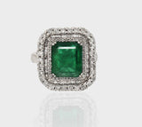Ring, a dazzling fusion of timeless elegance and natural allure, featuring a captivating Colombian Emerald embraced by sparkling diamonds.(PGDR063)