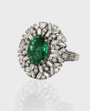Emerald and Diamond Ring, featuring captivating oval emeralds and sparkling diamond baguettes and round. Each exquisite detail is meticulously crafted to exude elegance and charm, making it the perfect statement piece for any occasion.(PGDR0365)