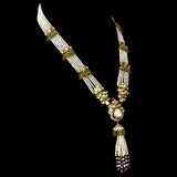 A mesmerizing fusion-style necklace and jhoomki pair adorned with diamond polki, round diamond stringing, lustrous pearls, and vibrant emerald and ruby beads - KMNE3486