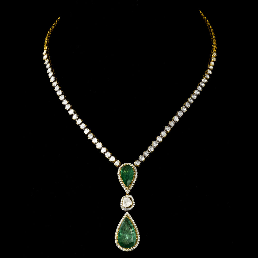 Elegant single-line necklace featuring dazzling diamond Polki, sparkling diamond rounds, and a stunning cut emerald pear - KMNE3538
