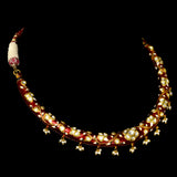 Exquisite traditional red Meena Hasli necklace and earring set, adorned with dazzling diamond Polki and elegant pearl accents.  - KMNE3552