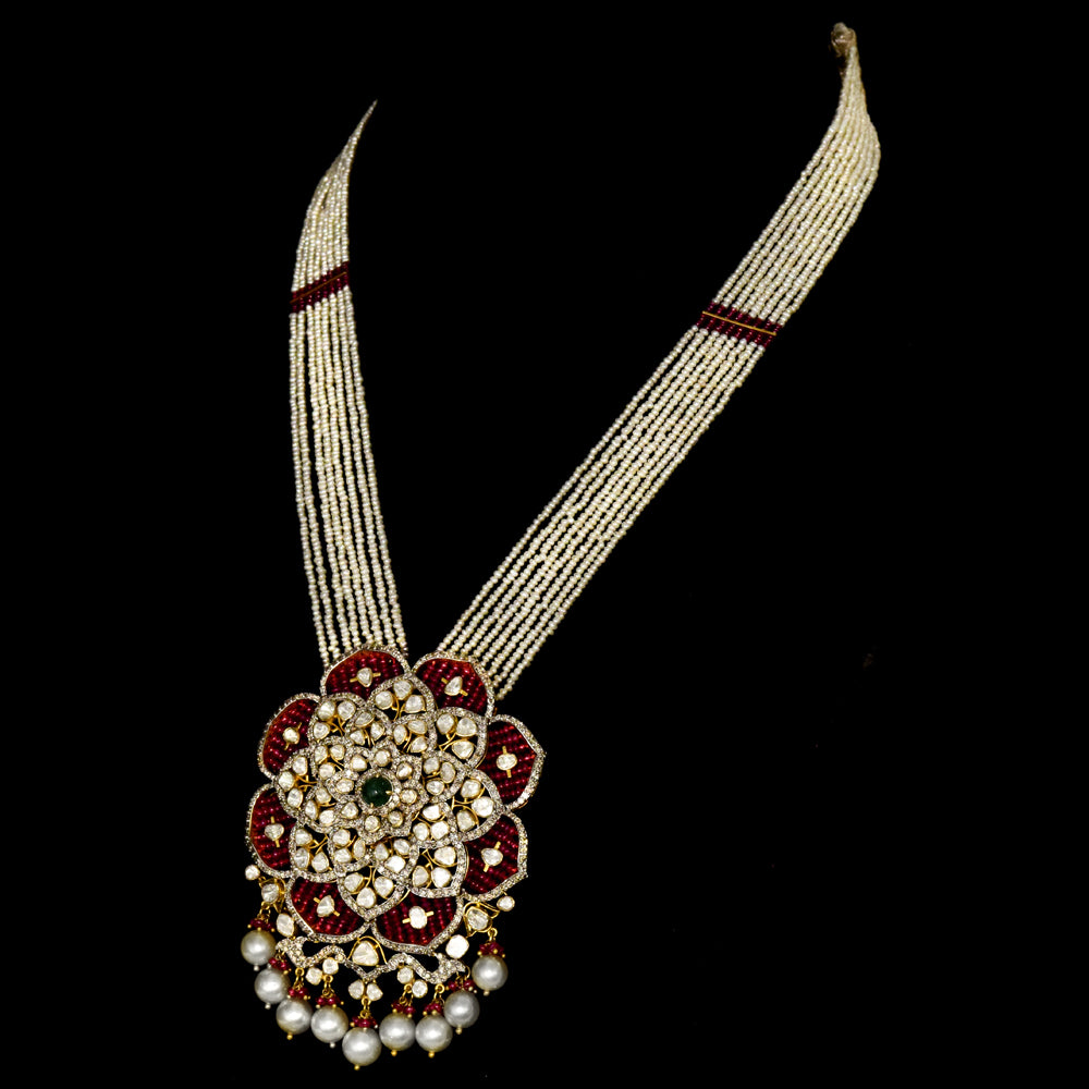 Exquisite fusion-style pendant and earring set, featuring dazzling diamond Polki, rose-cut diamonds, and emerald cabochons, elegantly strung with pearls and ruby beads. - KMPE1307