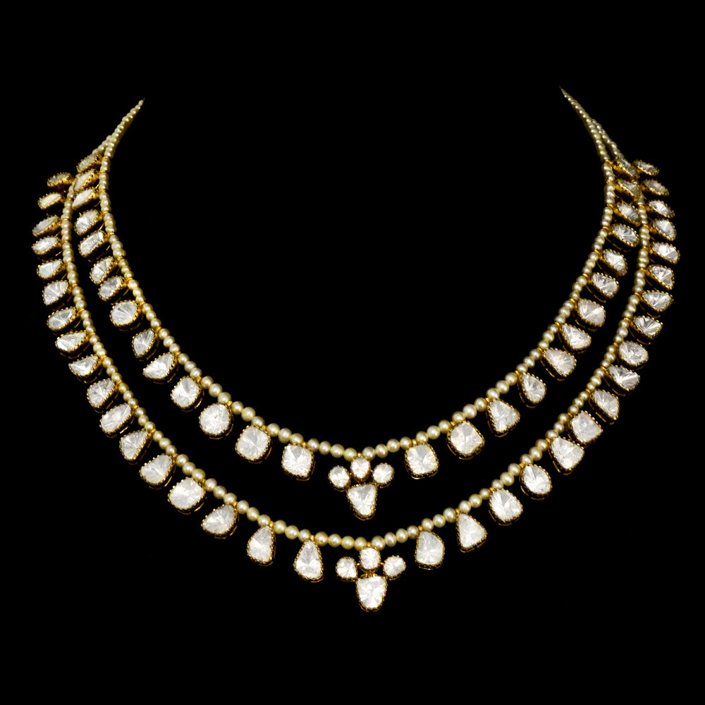 Elegant double-line necklace adorned with dazzling diamond Polki and gracefully strung with lustrous pearls. - WDN1190
