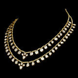 Elegant double-line necklace adorned with dazzling diamond Polki and gracefully strung with lustrous pearls. - WDN1190