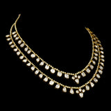 Elegant double-line necklace adorned with dazzling diamond Polki and gracefully strung with lustrous pearls. - WDN1190