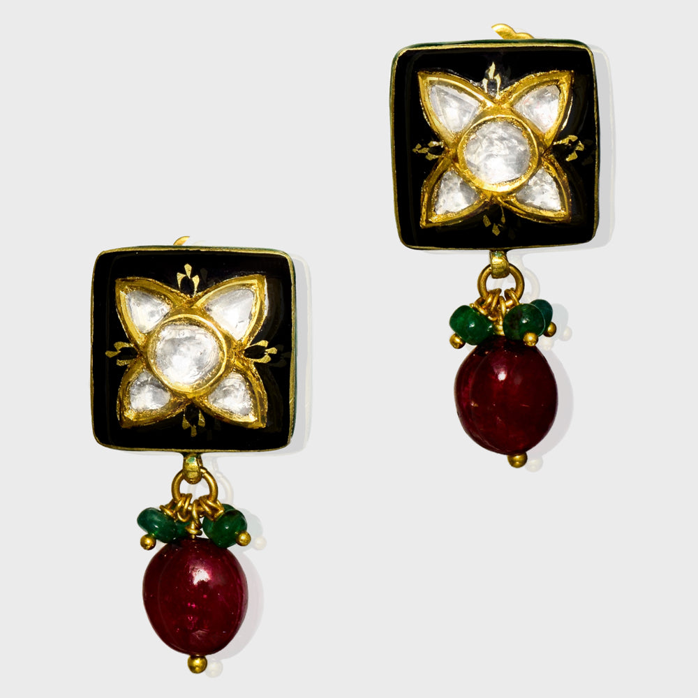 Elegant black Meena pendant and tops set, adorned with dazzling diamond Polki and gracefully strung with emerald and ruby beads. - KMPE1319