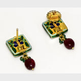 Elegant black Meena pendant and tops set, adorned with dazzling diamond Polki and gracefully strung with emerald and ruby beads. - KMPE1319