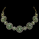 Exquisite diamond and emerald jewelry set featuring a floral-inspired necklace, earrings, and ring. - pgdne0136
