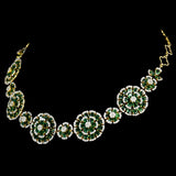 Exquisite diamond and emerald jewelry set featuring a floral-inspired necklace, earrings, and ring. - pgdne0136