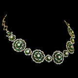 Exquisite diamond and emerald jewelry set featuring a floral-inspired necklace, earrings, and ring. - pgdne0136