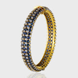 Adorn your wrist with the timeless elegance of our blue sapphire and diamond bangle - (GDB0238)
