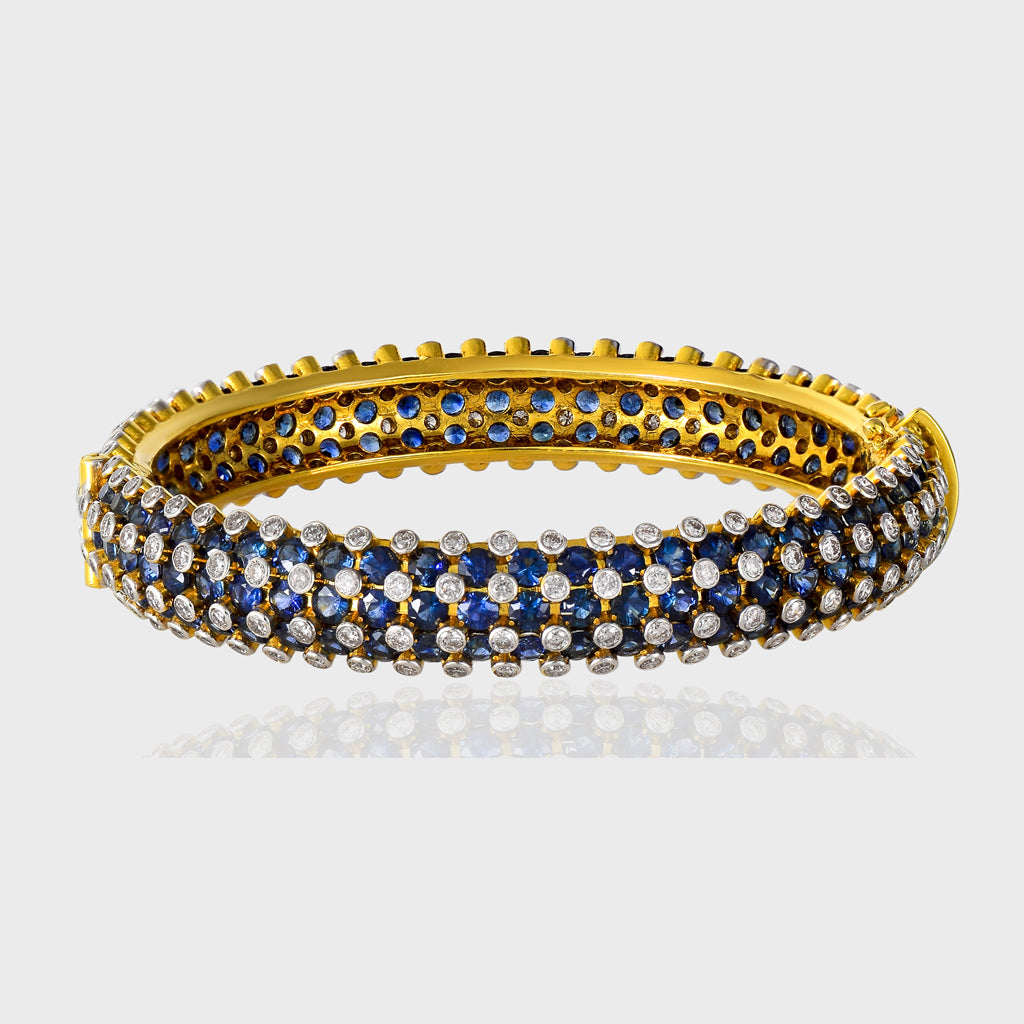 Adorn your wrist with the timeless elegance of our blue sapphire and diamond bangle - (GDB0238)