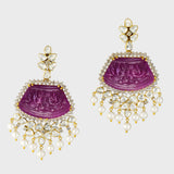 our luxurious long earrings adorned with intricately carved ruby stones, shimmering diamond polki, and radiant diamond rounds. Complete with delicate pearl hangings, these earrings exude timeless sophistication and charm. (GDE0437)