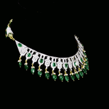 This elegant necklace set features sparkling diamonds and rich green emeralds, beautifully paired with emerald maniya stringing. A perfect blend of classic charm and modern design, ideal for weddings, parties, or special occasions. (GDNE0512)