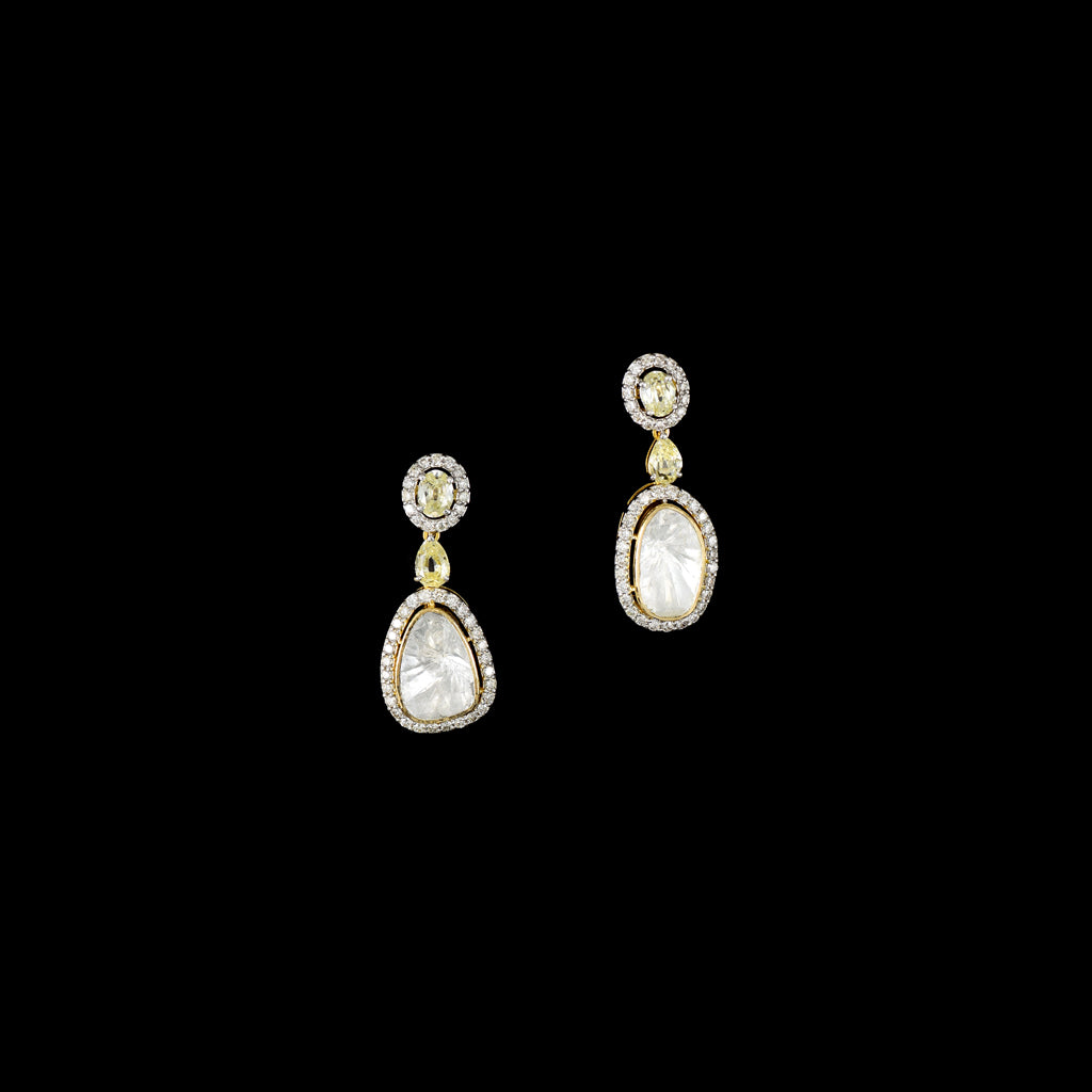 Elegant earrings featuring big-size Polki, sparkling round diamonds, and beautifully cut mutual diamonds. A stunning blend of traditional charm and modern sparkle—perfect for adding glamour to any special occasion.(GDNE0525)