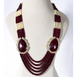 Regal Ruby Beaded Statement Necklace A magnificent statement necklace featuring oversized ruby centrepieces framed with dazzling diamonds, gracefully strung with ruby beads and luminous pearls for unmatched royal elegance.(GDNE0552)