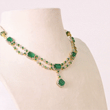 A stunning blend of emerald-cut emeralds and sparkling diamonds, this elegant necklace set is crafted to make every occasion unforgettable.(GDNE0553)