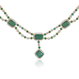 A stunning blend of emerald-cut emeralds and sparkling diamonds, this elegant necklace set is crafted to make every occasion unforgettable.(GDNE0553)