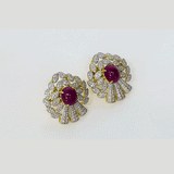 An exquisite pendant and earring set featuring red oval ruby cabochons accented with brilliant diamonds. Offering timeless elegance, rich colour, and refined luxury for a striking statement. (GDPE0403)