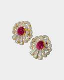 An exquisite pendant and earring set featuring red oval ruby cabochons accented with brilliant diamonds. Offering timeless elegance, rich colour, and refined luxury for a striking statement. (GDPE0403)