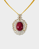 An exquisite pendant and earring set featuring red oval ruby cabochons accented with brilliant diamonds. Offering timeless elegance, rich colour, and refined luxury for a striking statement. (GDPE0403)