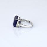 A mesmerizing deep blue sapphire ring adorned with sparkling diamonds, crafted to reflect timeless elegance, luxury, and sophistication for every special occasion.(GDR0350)