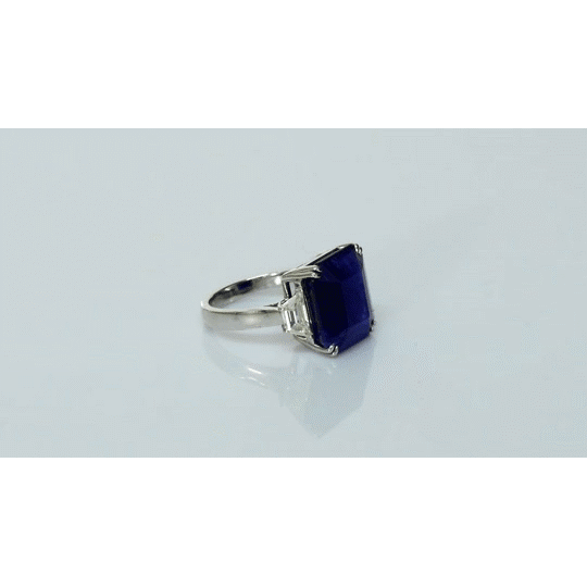 A mesmerizing deep blue sapphire ring adorned with sparkling diamonds, crafted to reflect timeless elegance, luxury, and sophistication for every special occasion.(GDR0350)