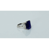 A mesmerizing deep blue sapphire ring adorned with sparkling diamonds, crafted to reflect timeless elegance, luxury, and sophistication for every special occasion.(GDR0350)