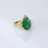 Pear-cut emerald ring with sparkling diamonds, designed for timeless elegance, luxury, and everyday sophistication.(KCA-8)