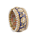 Blue meena broad kada in 22k gold with uncut diamond The broad size of the kada ensures that it fits comfortably on most wrist sizes and the sturdy construction makes it a durable piece of jewelry that can be treasured for years to come.  - KMB0485