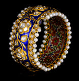 Blue meena broad kada in 22k gold with uncut diamond The broad size of the kada ensures that it fits comfortably on most wrist sizes and the sturdy construction makes it a durable piece of jewelry that can be treasured for years to come.  - KMB0485