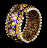 Blue meena broad kada in 22k gold with uncut diamond The broad size of the kada ensures that it fits comfortably on most wrist sizes and the sturdy construction makes it a durable piece of jewelry that can be treasured for years to come.  - KMB0485