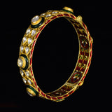 Kada pair with green churi meena in 18k gold and uncut diamond.Green Churi Meena Bangle is a beautiful and traditional piece of jewelry that adds a touch of elegance to any outfit. - KMB0538