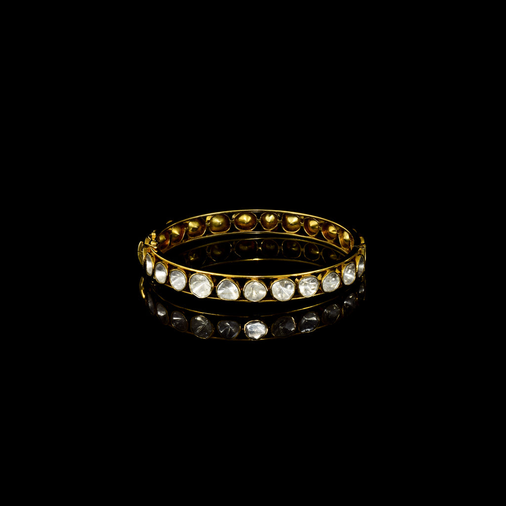 Elegant gold bangle featuring round uncut polki diamonds in a classic setting—perfect for adding timeless charm to any attire.(KMB0549)