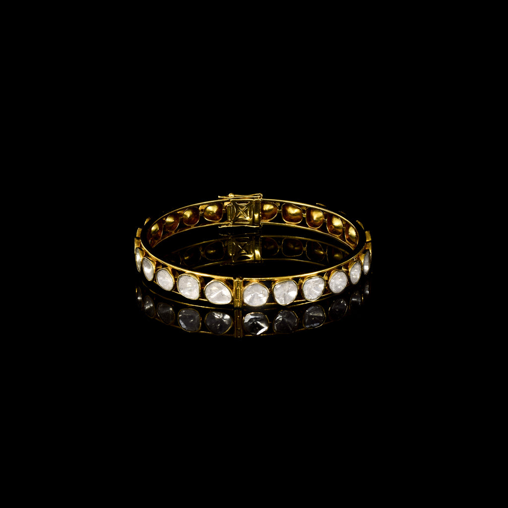 Elegant gold bangle featuring round uncut polki diamonds in a classic setting—perfect for adding timeless charm to any attire.(KMB0549)