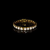 Elegant gold bangle featuring round uncut polki diamonds in a classic setting—perfect for adding timeless charm to any attire.(KMB0549)