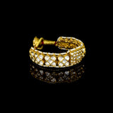 Luxurious handcrafted gold Pounchi Bangle adorned with intricate polki diamond floral motifs and bordered with delicate pearls. A perfect blend of traditional artistry and royal elegance.(KMB0581)