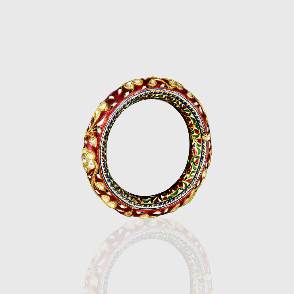 Elegant antique gold bangle featuring large square polki diamonds accented with fine detailing. A timeless piece that reflects royal heritage and impeccable craftsmanship for special occasions.(KMB0587)