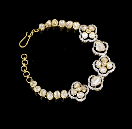 Elegant handcrafted Fusion style bracelet featuring floral motifs and sparkling polki diamond and Full cut diamond . A perfect blend of traditional artistry and modern charm.(KMBR0139)