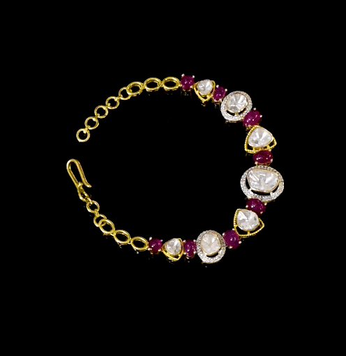 A stunning fusion-style bracelet featuring diamond Polki, sparkling round diamonds, and rich rubies. Perfect for adding a touch of tradition and modern charm to any look.(KMBR0141)
