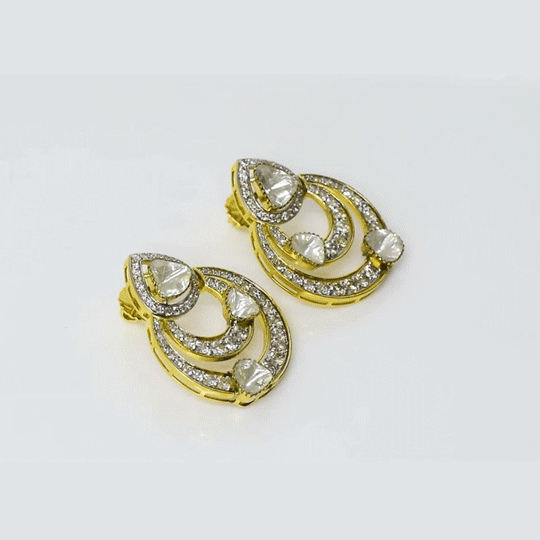 A fusion-style chandbali earring pair crafted with round brilliant diamonds and diamond polki, blending traditional elegance with contemporary finesse. Intricate detailing and graceful curves make it perfect for weddings and festive occasions. (KME2426)