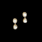 Elegant dangling earrings featuring a bold diamond Polki at the center, beautifully surrounded by sparkling round diamonds. A timeless design that adds graceful charm and brilliance to any special occasion.(KME2441)