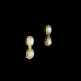 Elegant dangling earrings featuring a bold diamond Polki at the center, beautifully surrounded by sparkling round diamonds. A timeless design that adds graceful charm and brilliance to any special occasion.(KME2441)
