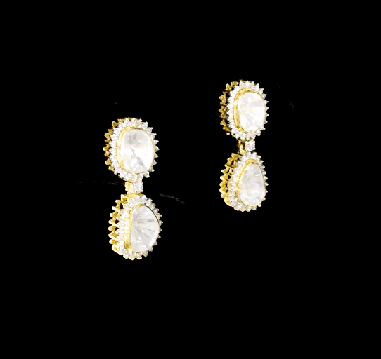 Elegant dangling earrings featuring a bold diamond Polki at the center, beautifully surrounded by sparkling round diamonds. A timeless design that adds graceful charm and brilliance to any special occasion.(KME2441)