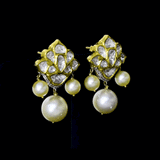 Gracefully crafted with radiant Diamond Polki, sparkling round diamonds, and South Sea pearl drops, these earrings exude refined luxury and effortless charm.(KME2531)