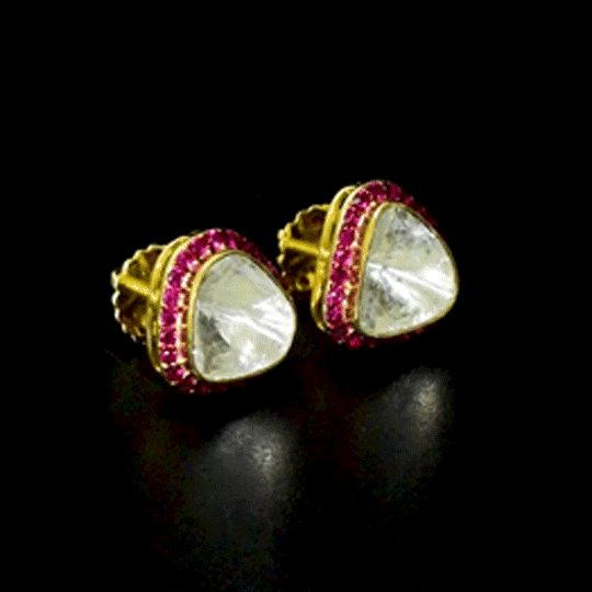 Fusion Diamond Polki & Ruby Tops A bold Diamond Polki centre embraced by vibrant ruby accents, these fusion-style tops beautifully combine timeless heritage with contemporary elegance for every occasion.(KME2533)