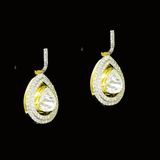 Diamond Polki Drop Earrings Designed to captivate, these drop earrings showcase luminous Diamond Polki framed by brilliant round diamonds, creating a graceful silhouette with modern sophistication and effortless sparkle.(KME2544)