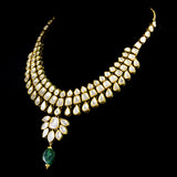 Radiate timeless elegance with our exquisite necklace set, featuring shimmering diamond polki complemented by the enchanting allure of emerald maniyas.(KMNE2892)