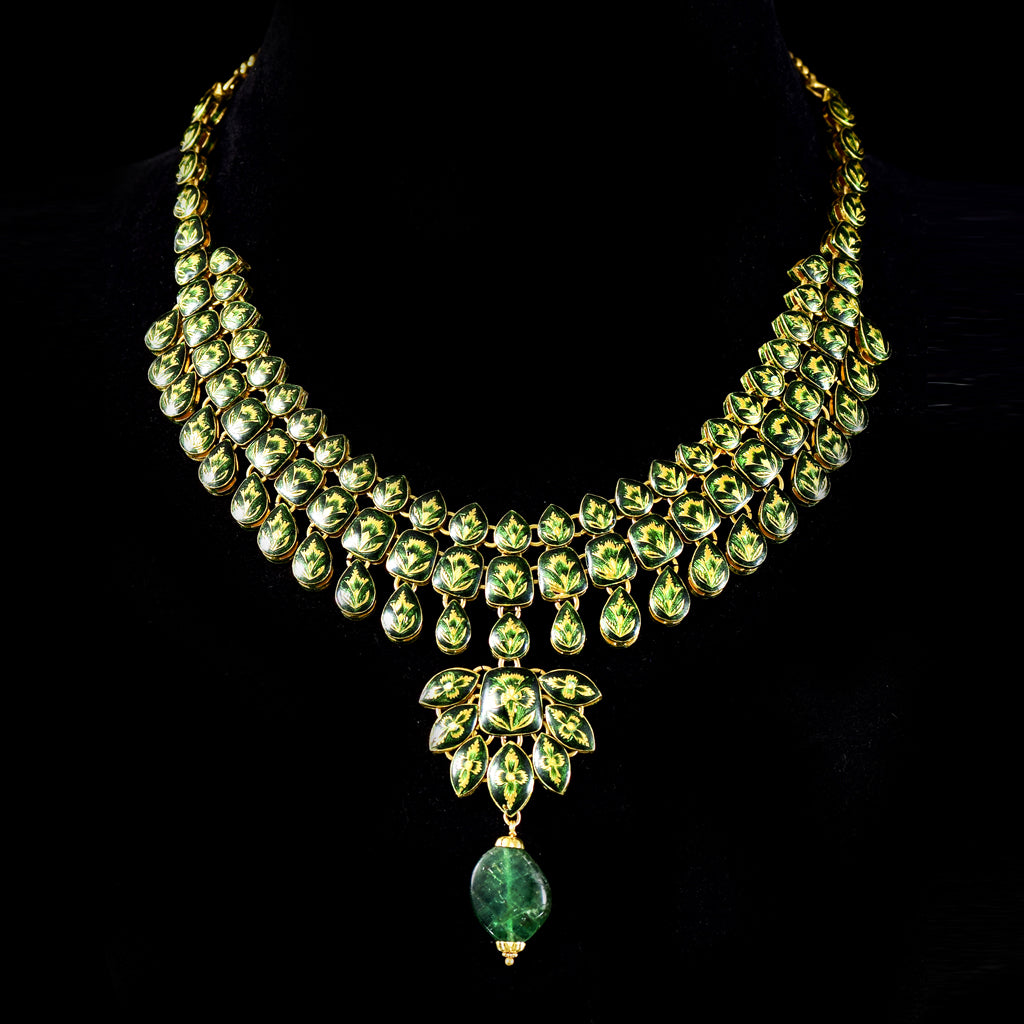 Radiate timeless elegance with our exquisite necklace set, featuring shimmering diamond polki complemented by the enchanting allure of emerald maniyas.(KMNE2892)