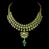 Radiate timeless elegance with our exquisite necklace set, featuring shimmering diamond polki complemented by the enchanting allure of emerald maniyas.(KMNE2892)